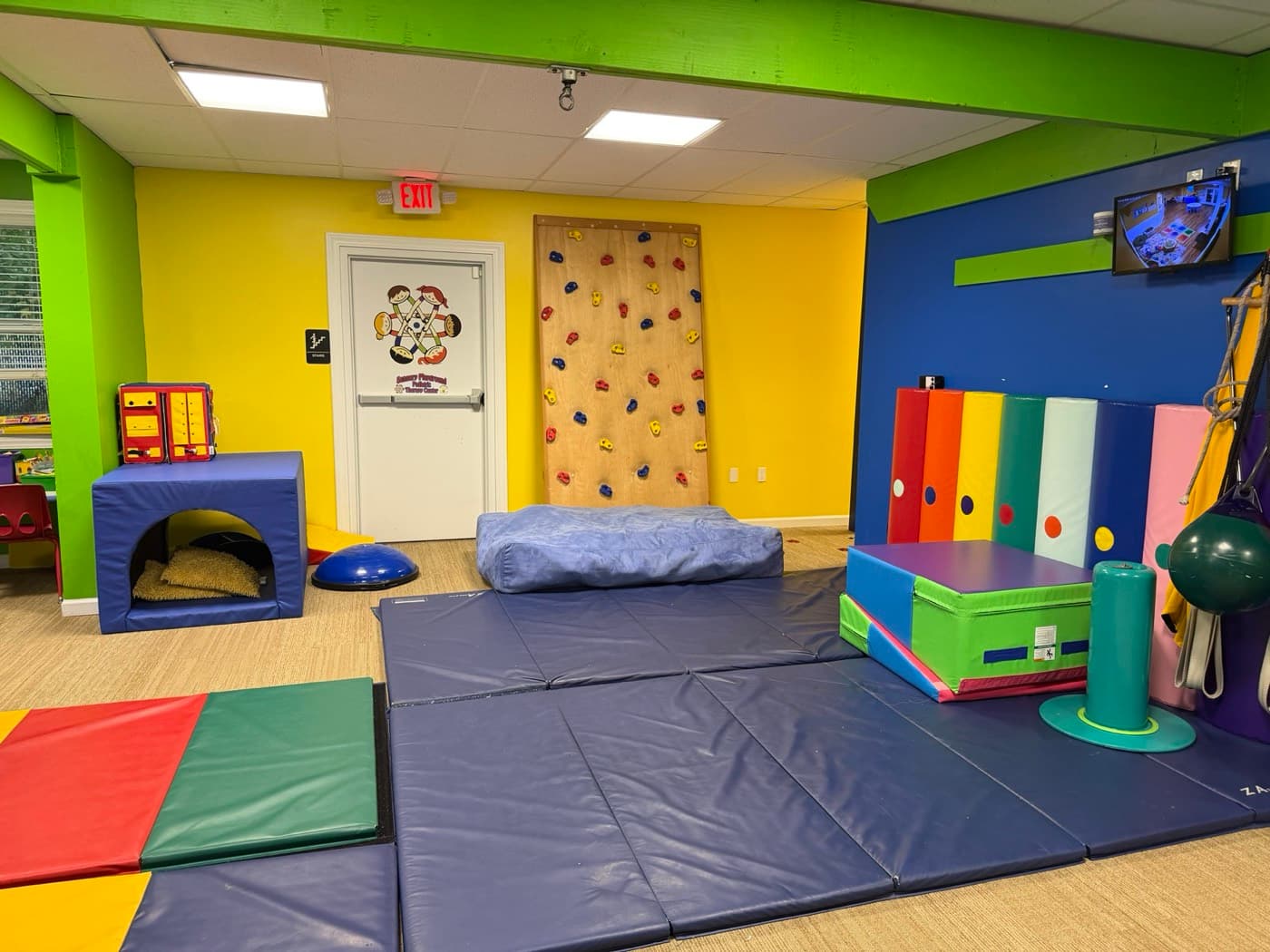 The sensory gym with climbing wall and crash mats