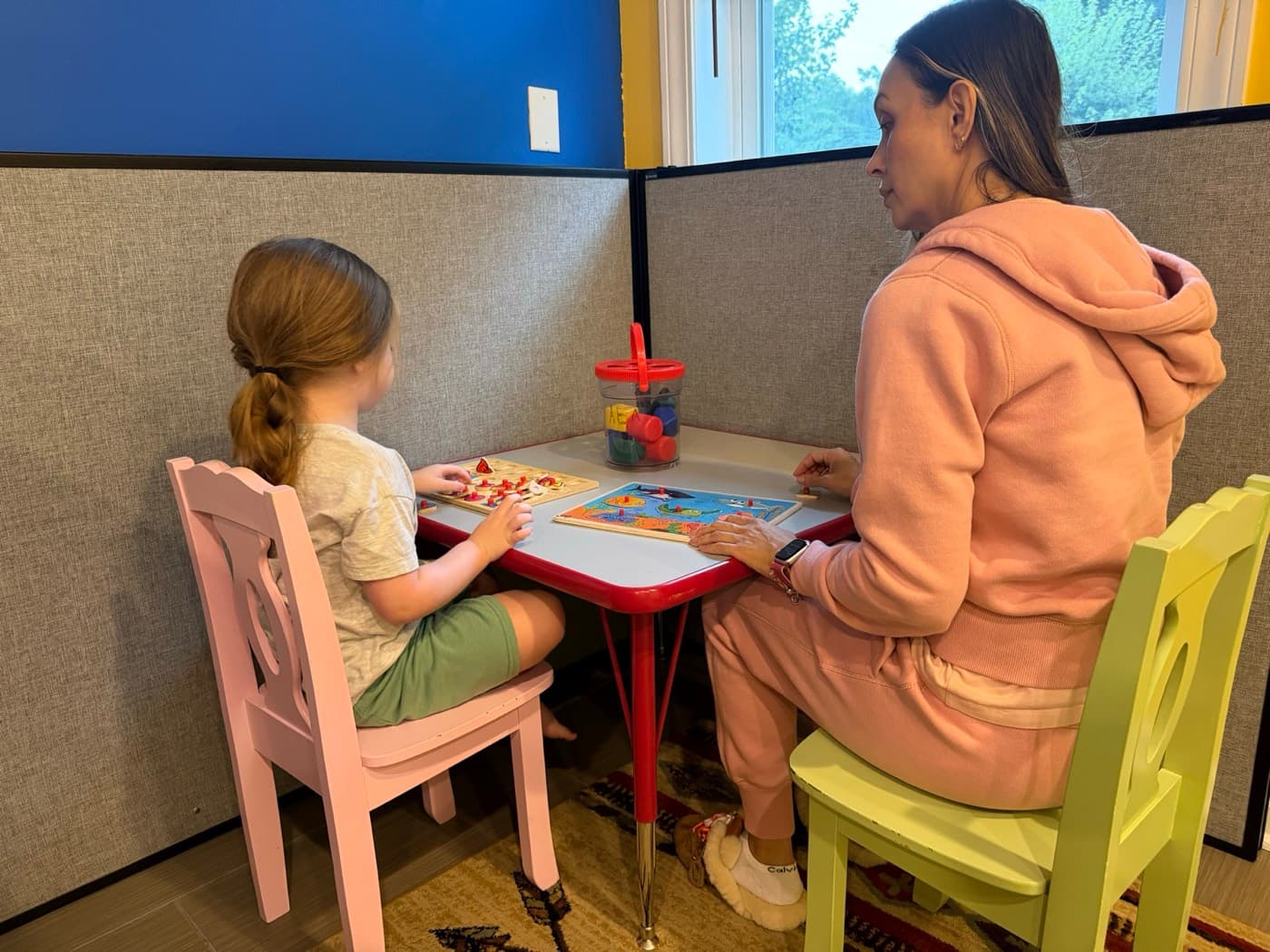 A therapist working one-on-one with a child
